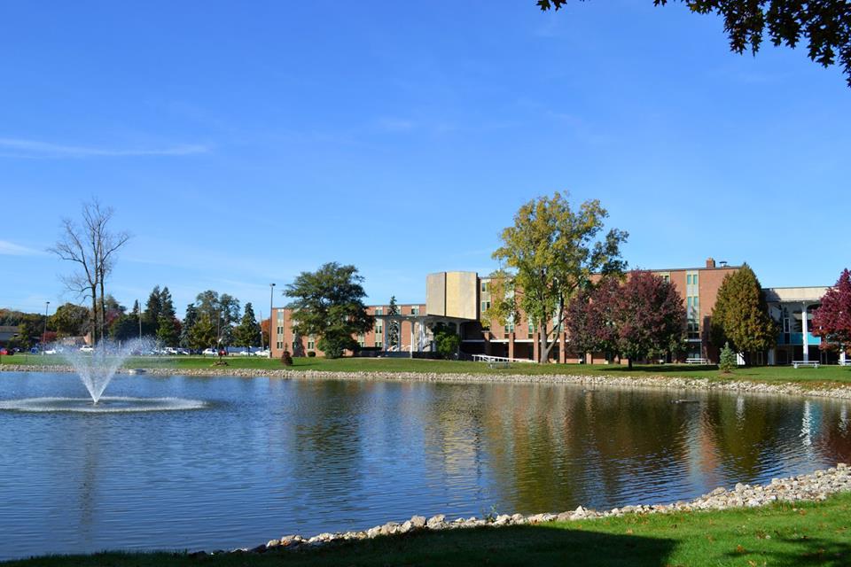 Madonna Campus Shot with Pond and Student Dorms featured